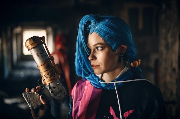 A cosplayer dressed as Jinx from Arcane, showcasing the character's vibrant blue hair, tattoos, and eclectic outfit. The background features graffiti art inspired by the Undercity, adding to the authenticity of the cosplay.