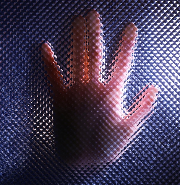 A detailed close-up of Sevika's augmented arm, showcasing the intricate detailing of the metal plating and the way it connects to her glove. The image highlights textures and contours.