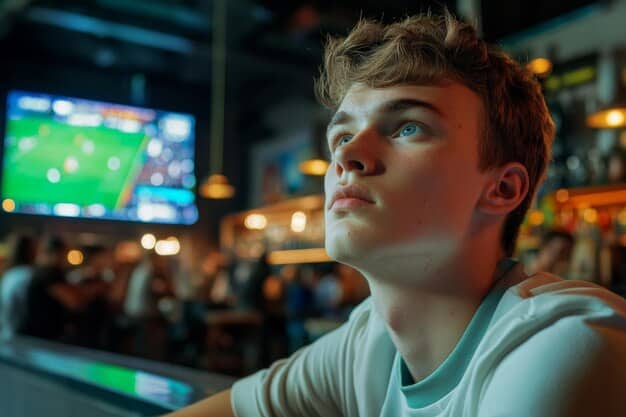 A close-up shot of a young player intensely focused on their screen during an LCS Academy match, showcasing the dedication and concentration required to succeed in esports.