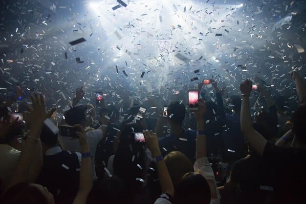 A dynamic shot of a League of Legends team celebrating a victory on stage at the LCS Championship, with confetti falling and team members high-fiving.