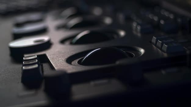 A close-up shot of a music producer in a studio, adjusting knobs on a mixing board. The background is blurred, but displays recording equipment and soundproofing material.