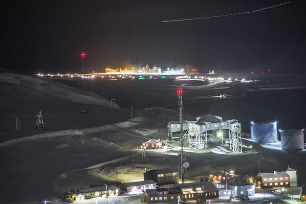 A Palworld base at night, with several Pals actively working in different stations (e.g., mining, farming, crafting) under the soft glow of lanterns, emphasizing the industrial aspect of Pal management.