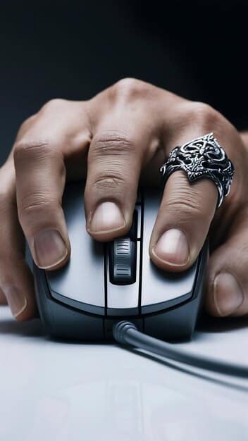 A close-up shot of a human hand on a high-performance gaming mouse and keyboard, with a blurred background showing screens displaying game analytics and a coach observing. The lighting is focused on the hands, suggesting intense focus and precision.