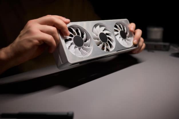 A detailed shot of an open gaming PC case, with a hand holding a can of compressed air, carefully blowing dust away from the GPU's fans and heatsink.