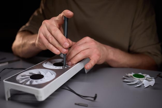 A gamer carefully applying new thermal paste to a CPU with a small spatula before reattaching the heatsink, showing meticulous maintenance.