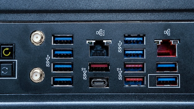 A close-up of the rear I/O panel of a modern gaming motherboard, showing various ports like USB-C, Ethernet, HDMI, and audio jacks, highlighting the diversity of connectivity options.