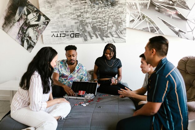 A diverse group of college students engaged in a focused esports team meeting, strategizing together with diagrams and whiteboards visible. Emphasizes collaboration and planning.