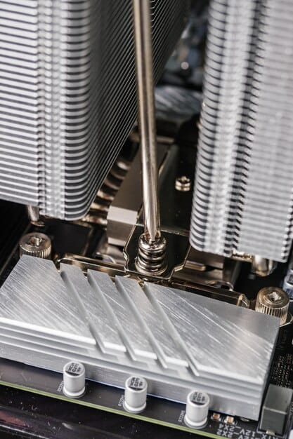 Close-up of a liquid CPU cooler pump unit with clear tubes and liquid visible, showcasing the water cooling system's design and efficiency. The inclusion of RGB lighting enhances the visual appeal and indicates high-performance capabilities.