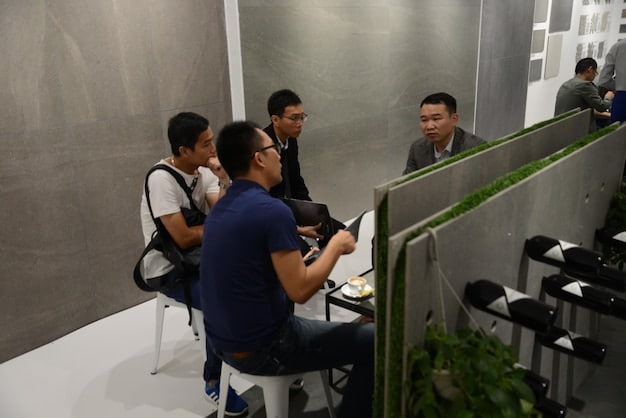 A behind-the-scenes look at an esports team's training facility in the US, showing players practicing, coaches strategizing, and support staff managing operations. The image should illustrate the professional environment and dedication required to compete at the highest levels, with a focus on Esports Organizations: A Comprehensive List of the Top Teams and Companies in the US.