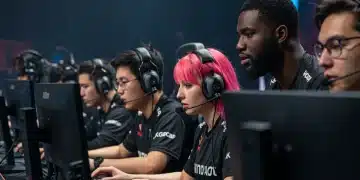 Esports team focused on screens in a competitive gaming arena